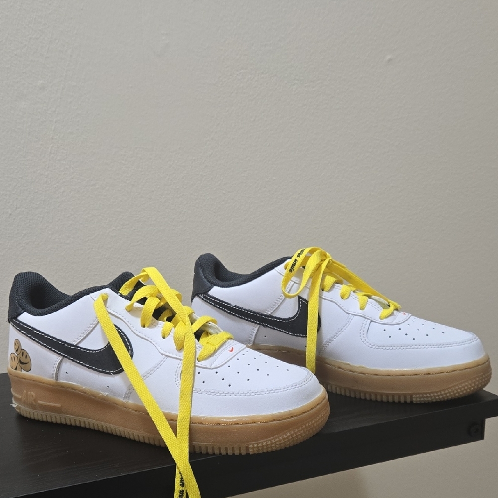 Air Force White Sneakers with Black Accents and Yellow Laces